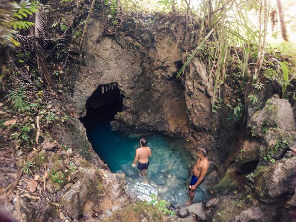 travelers about to go inside tayangban cave pool